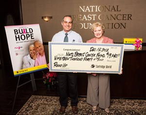 Cartridge World Presents the NBCF with a check