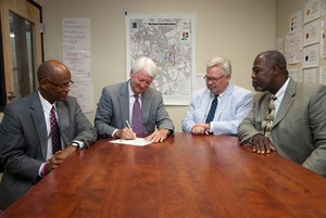 SECU and City of Durham officials signing Pledge of Support