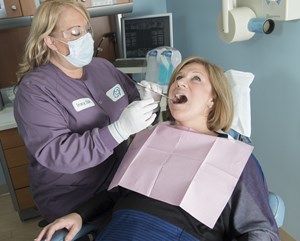 Dental hygienist and patient