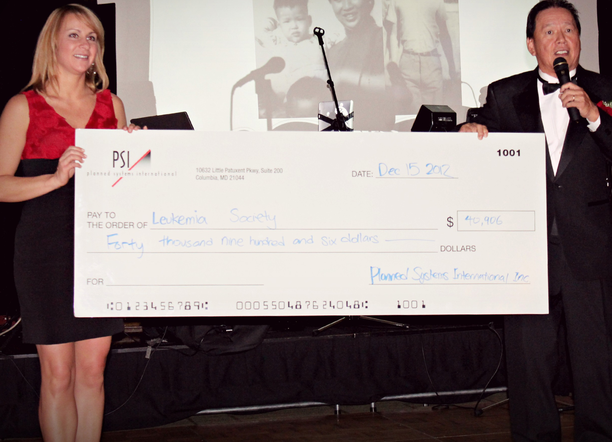 PSI CEO Terry Lin presents check to Beth Prensky of LLS