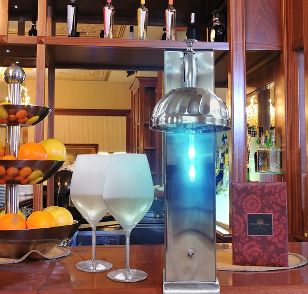 Vinotemp's new Il Romanzo CO2 Glass Chiller with blue LED lights frosts, chills and sterilizes glasses in seconds.