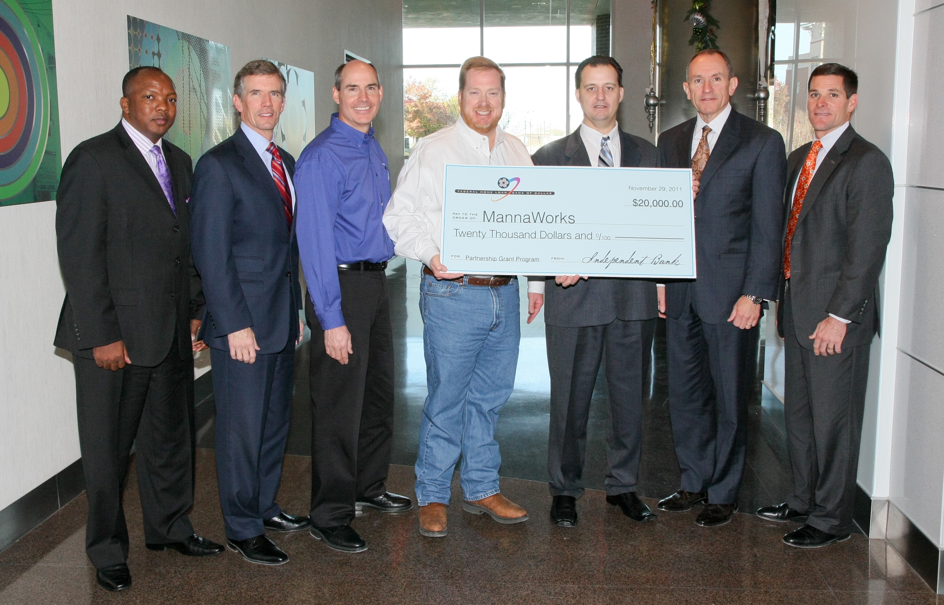 Officials Gathered to Present a $20K Partnership Grant to MannaWorks