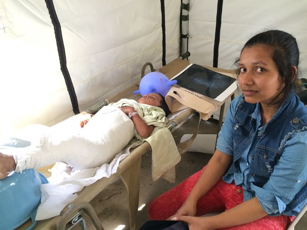 Nepalese Mother and Child Receive Medical Care in Nepal